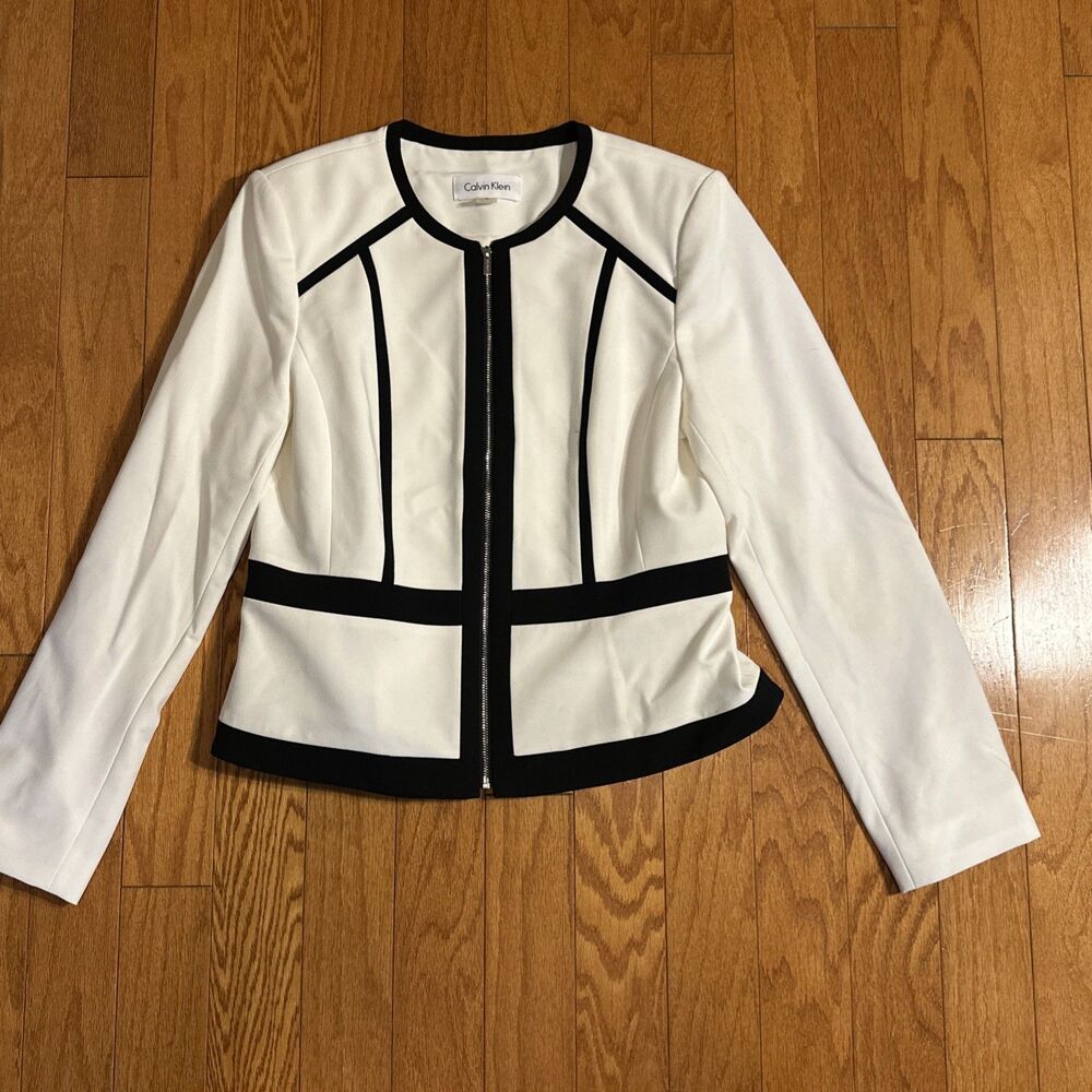 Calvin Klein white blazer with black piping and a zip-up front. Size 10